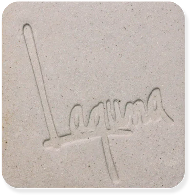 Square clay tile with embossed logo on a white background